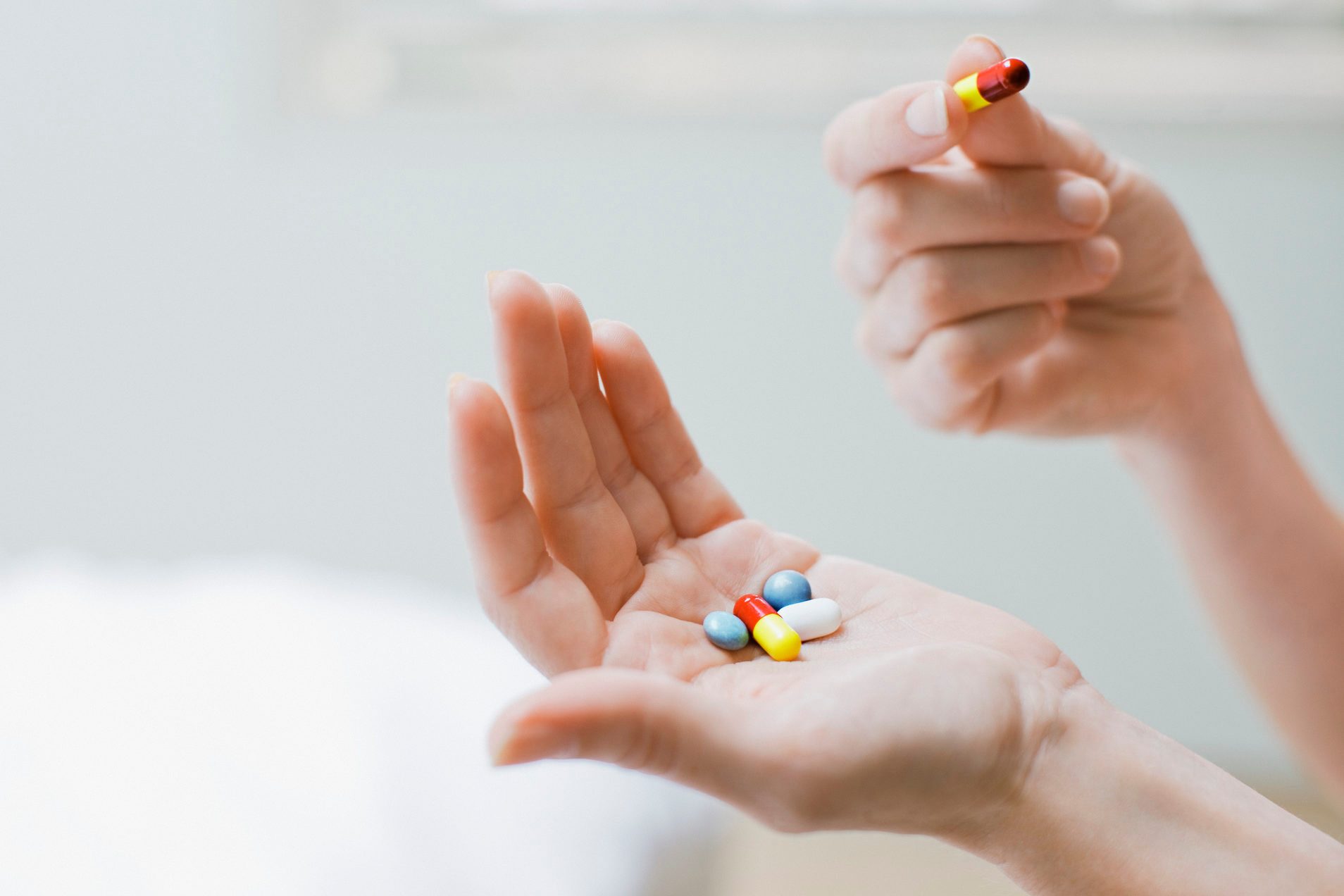 woman taking daily vitamins