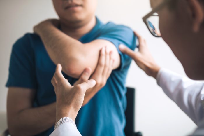 doctor checking patient's injury