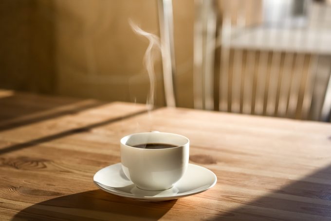 hot coffee in mug on kitchen table