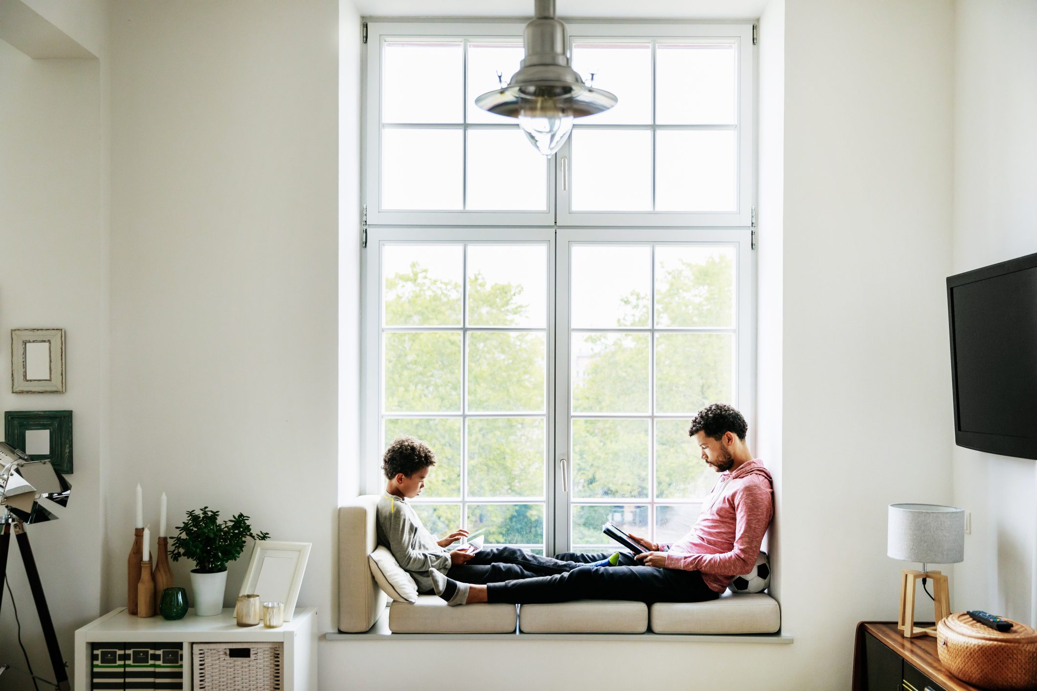 father and son relaxing at home