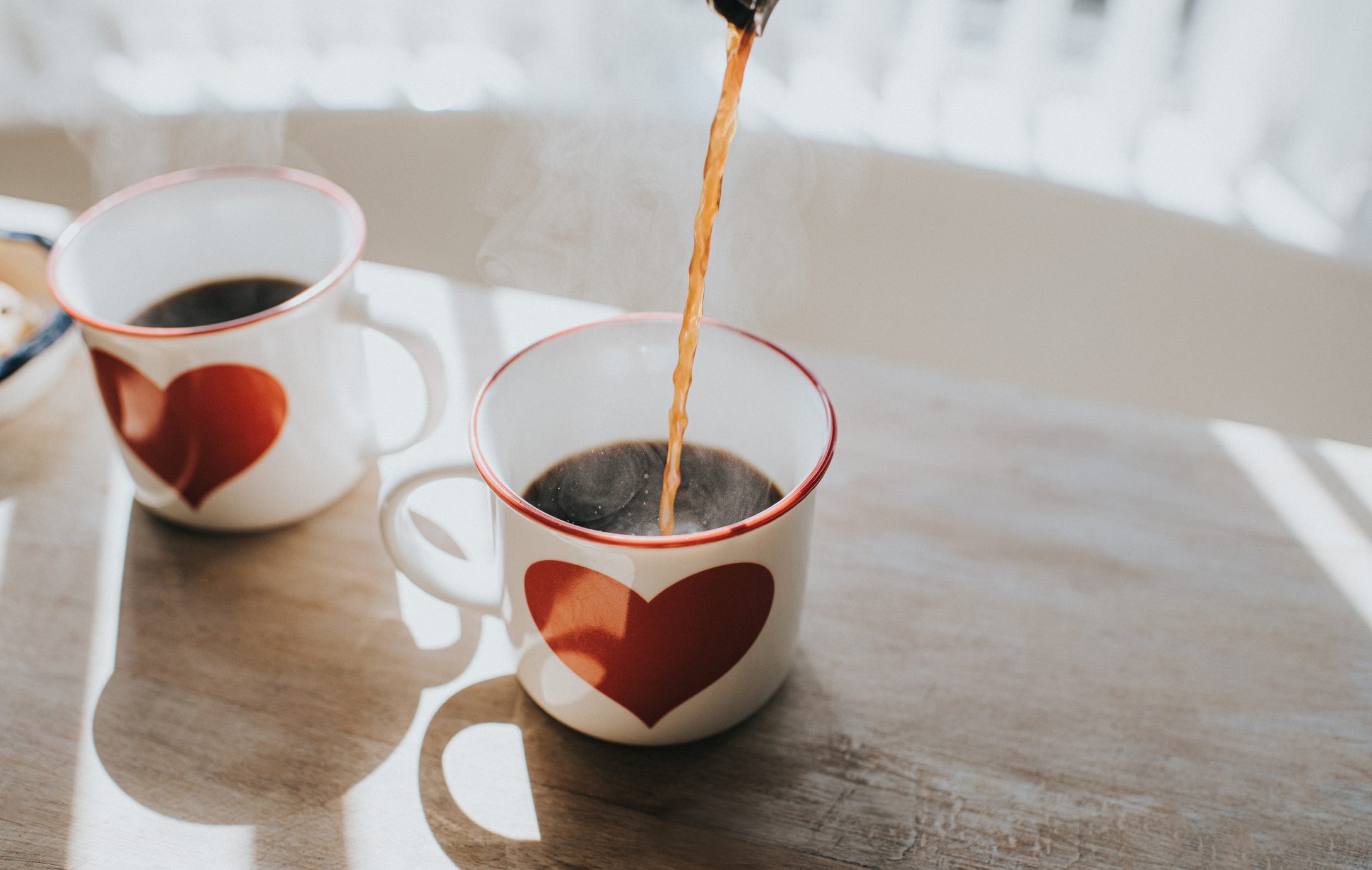 hot coffee being poured into mug