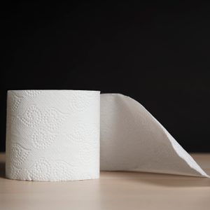 roll of toilet paper on black background