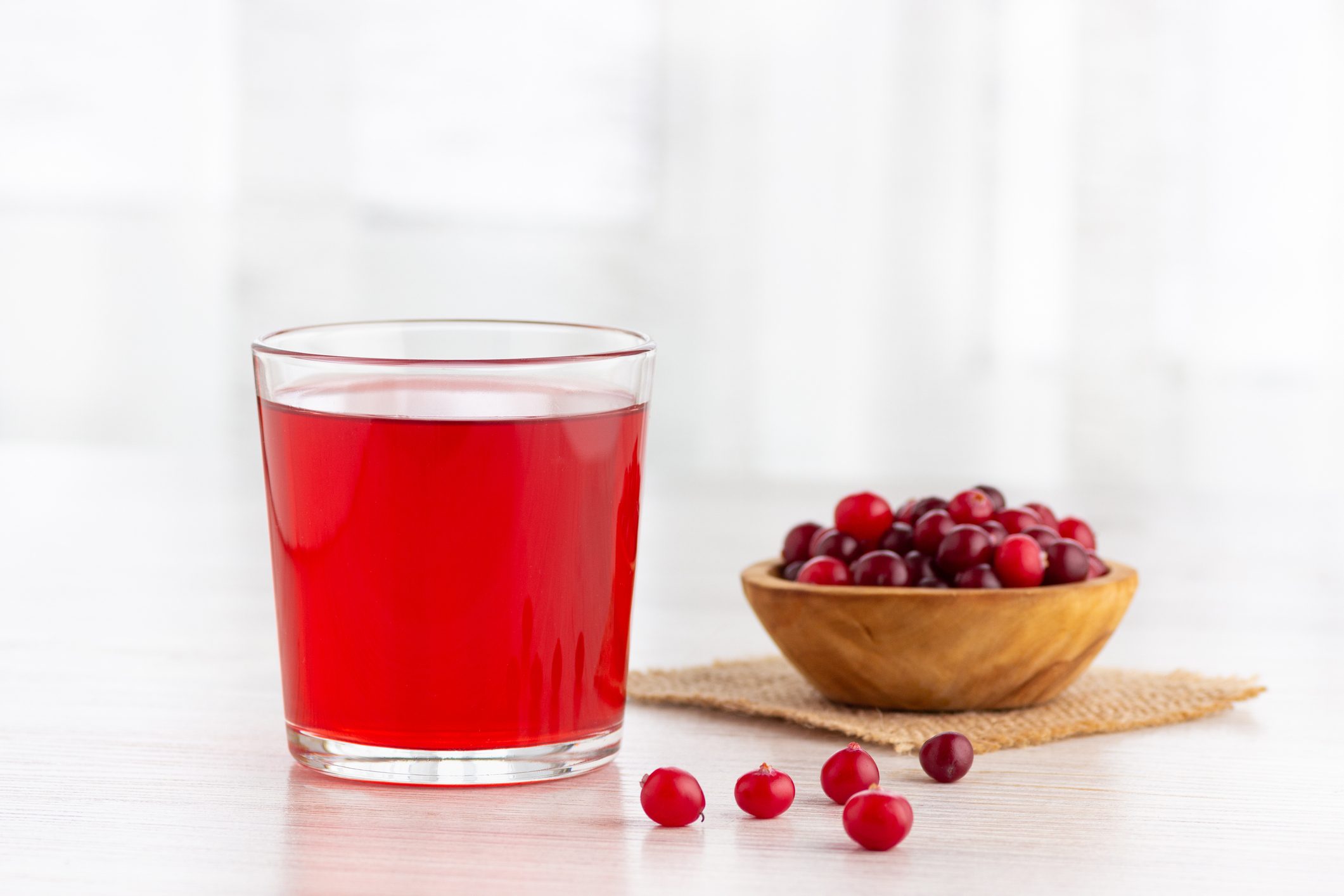 Glass with fresh organic cranberry juice.