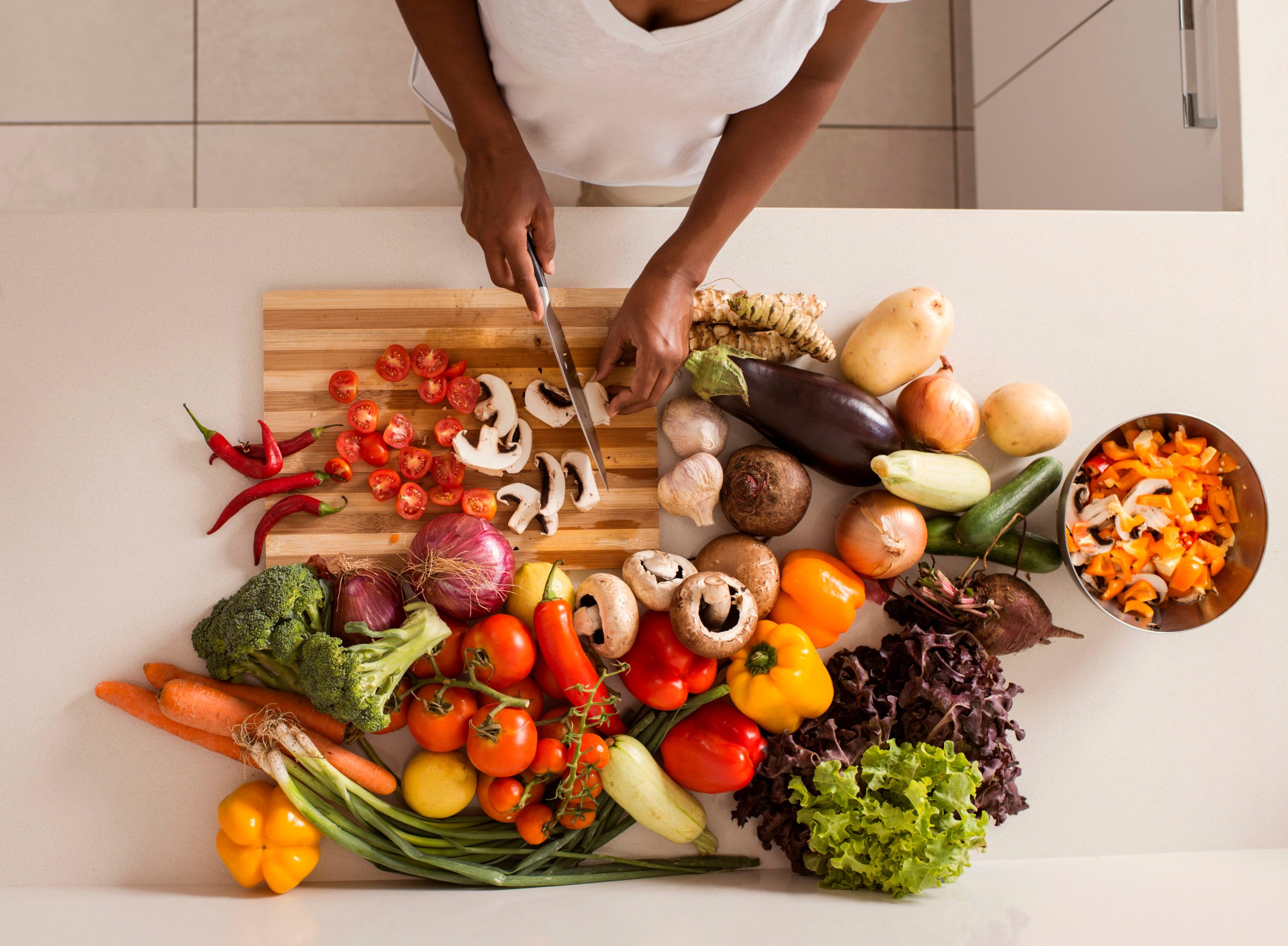 woman chopping vegetables in the kitchen