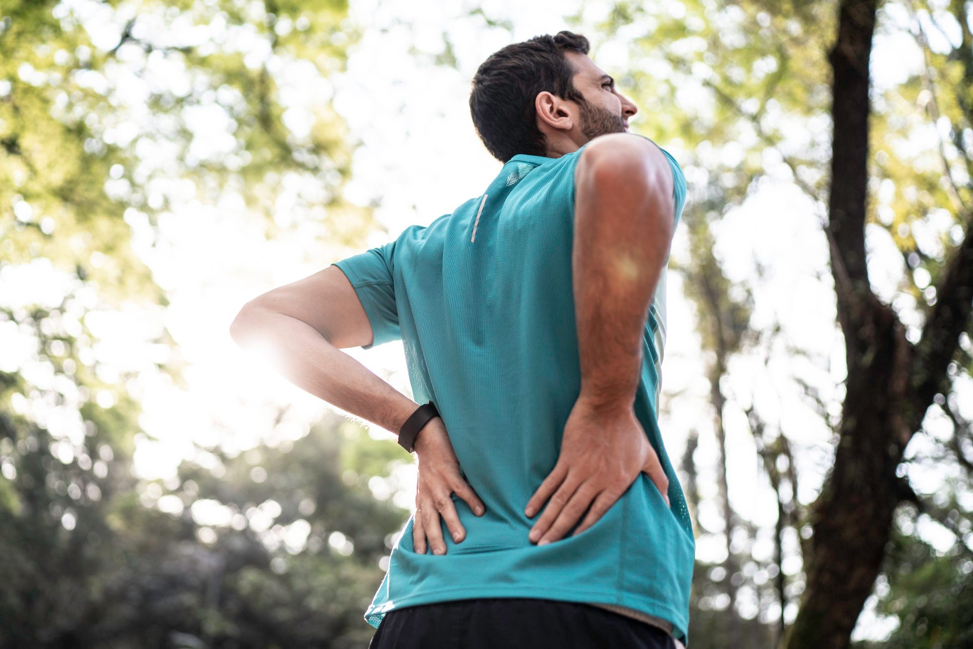 Sportsman feeling backache at a park