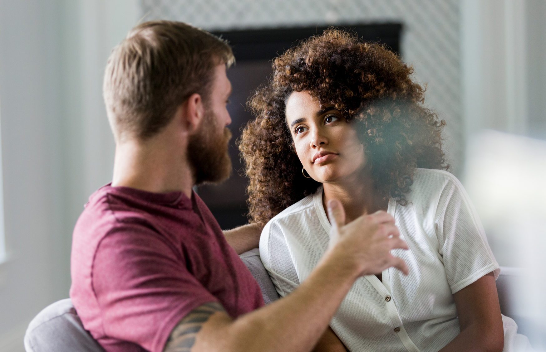 Mid adult woman listens seriously to husband's ideas