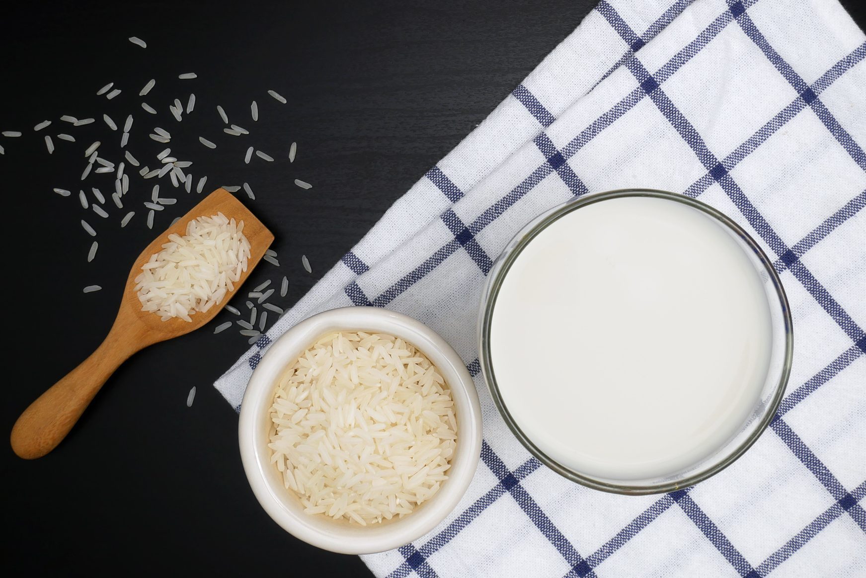 Milk and rice on the black table