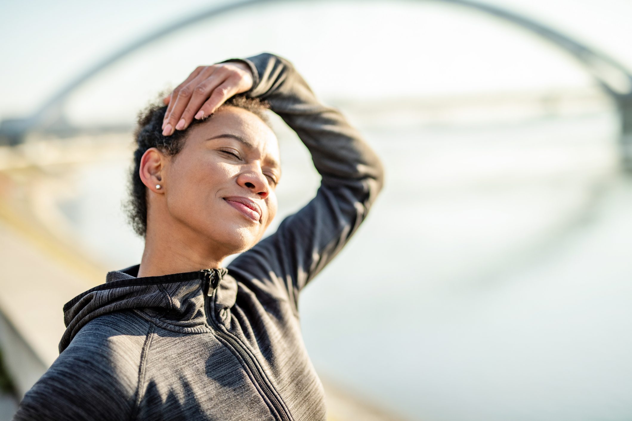 Athletic woman doing relaxing stretching exercises.