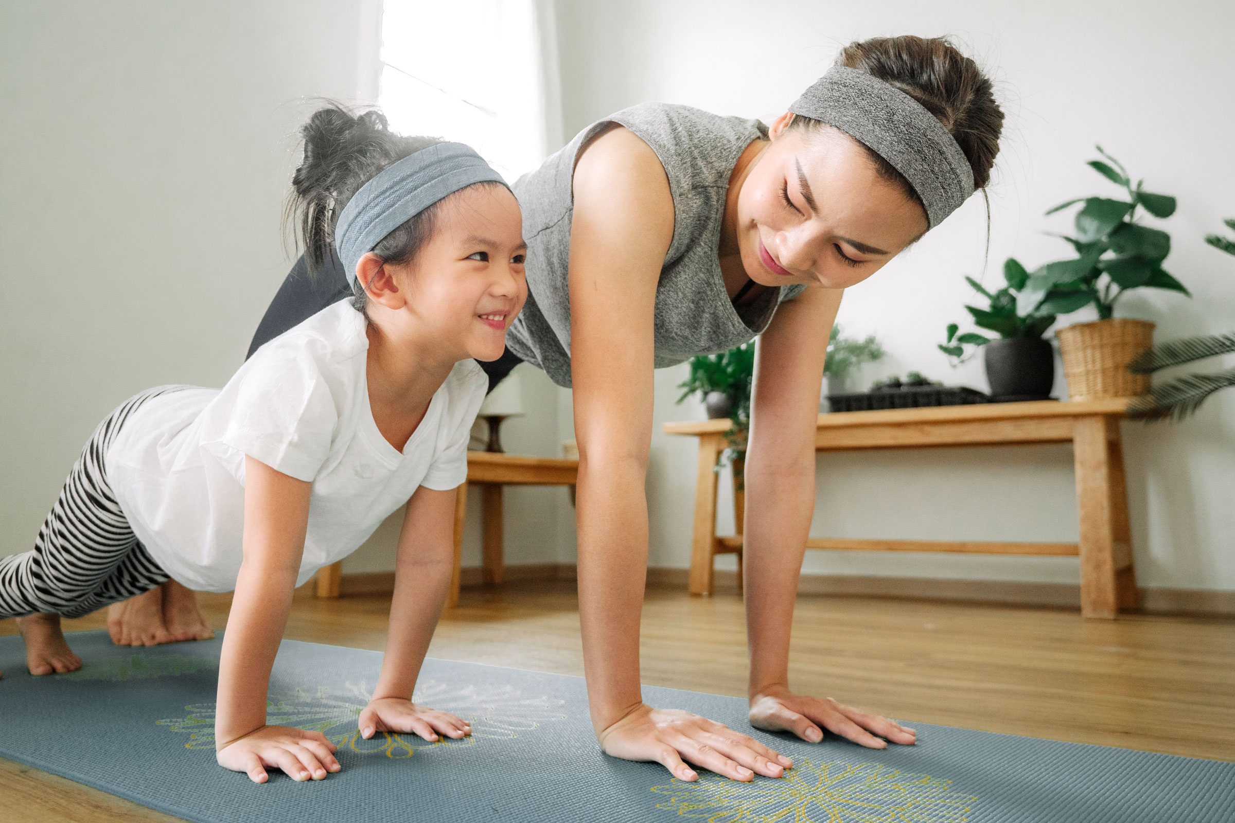 Mother and daughter doing yoga