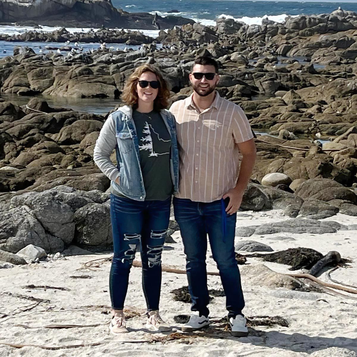 man and woman near the ocean