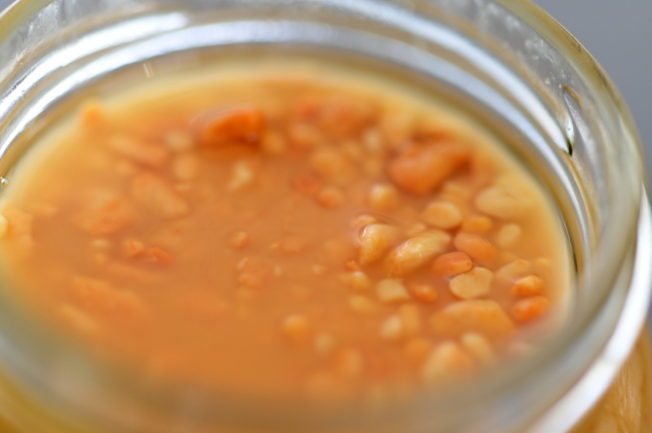 Crunchy peanut butter spread in a glass jar